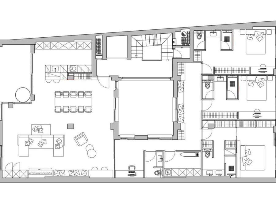 This stunning apartment boasts a spacious open-plan living area perfect for entertaining, complete with a large dining table and comfortable lounge furniture.