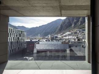 Modern apartment balcony with breathtaking mountain views.