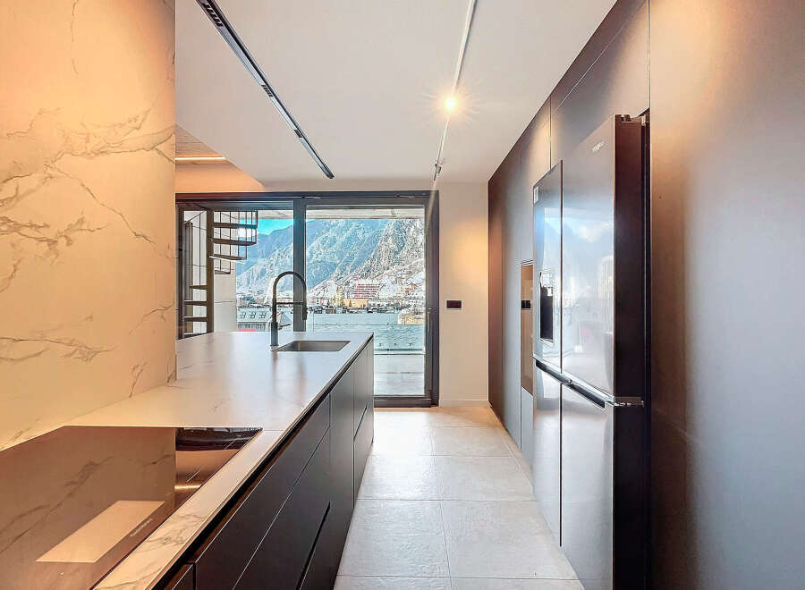 Modern kitchen with stunning mountain views.