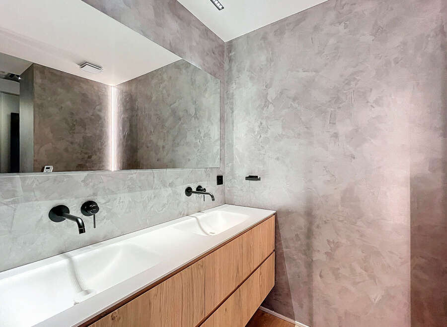 Modern bathroom with double vanity and sleek fixtures.
