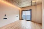 Modern apartment featuring sleek design and hardwood floors.