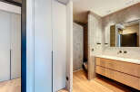 Modern bathroom with built-in cabinets and a sleek, minimalist design.