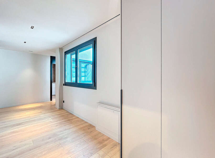 This stunning property boasts a bright and airy hallway with sleek, modern finishes.