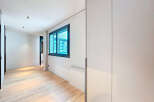 This stunning property boasts a bright and airy hallway with sleek, modern finishes.