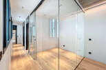 This stunning property boasts a sleek, modern design with glass sliding doors that create a bright and airy atmosphere.
