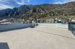 This stunning penthouse boasts a spacious rooftop terrace with breathtaking mountain views.