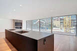 Modern kitchen island with integrated sink and stunning mountain views.