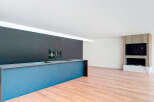 Stunning modern kitchen with sleek dark cabinetry and a built-in island, perfect for entertaining.