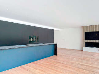 Stunning modern kitchen with sleek dark cabinetry and a built-in island, perfect for entertaining.