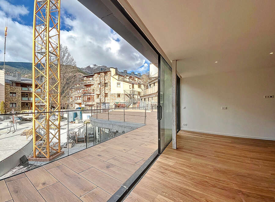 Modern apartment with stunning mountain views and a spacious balcony.