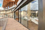 Modern apartment with stunning mountain views and a spacious balcony.