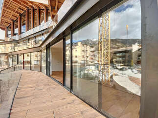 Modern apartment with stunning mountain views and a spacious balcony.