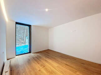 This stunning property boasts a spacious, bright room with gleaming hardwood floors and large windows offering abundant natural light.