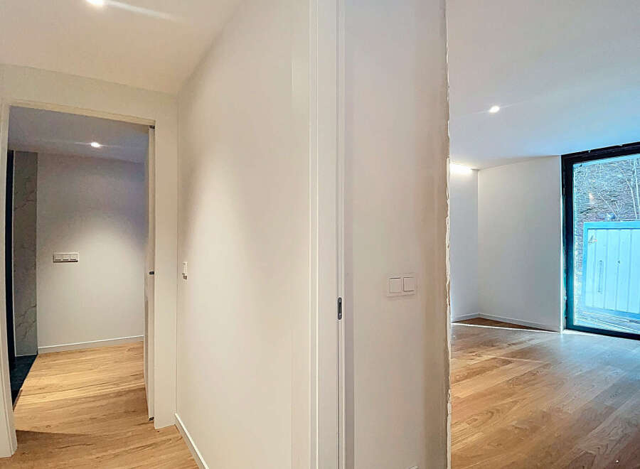 This stunning property boasts an open-plan living area with gleaming hardwood floors and large windows that flood the space with natural light.