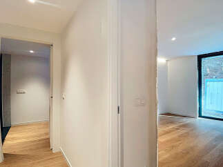 This stunning property boasts an open-plan living area with gleaming hardwood floors and large windows that flood the space with natural light.