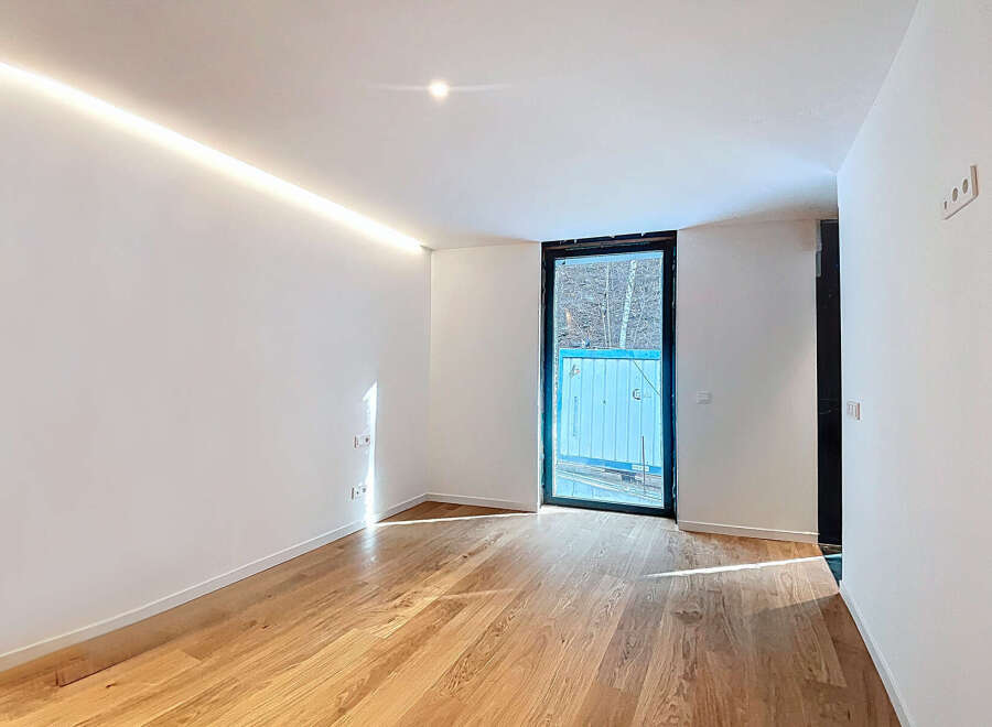 This stunning property boasts a bright and airy interior with sleek, modern finishes.