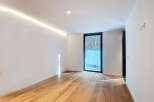 This stunning property boasts a bright and airy interior with sleek, modern finishes.