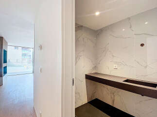 This stunning property boasts a modern, open-plan design with sleek, contemporary finishes.