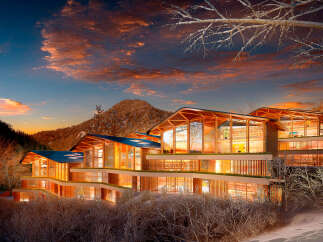 Luxury mountain retreat nestled in a snowy landscape.