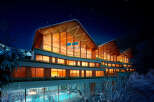 Luxury mountain retreat with stunning night views.
