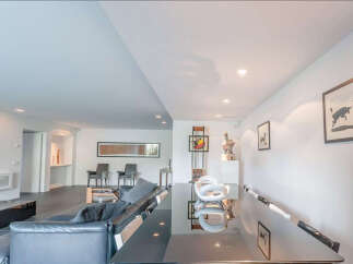 This stunning property boasts a sleek, modern design with an open-plan living area perfect for entertaining.