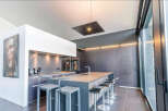 Modern kitchen with sleek countertops and high-end appliances.