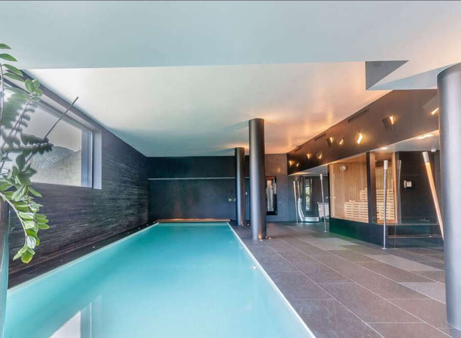 Indulge in luxury with this stunning indoor pool and spa.