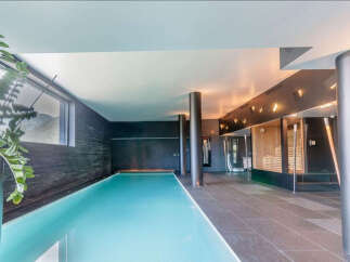 Indulge in luxury with this stunning indoor pool and spa.