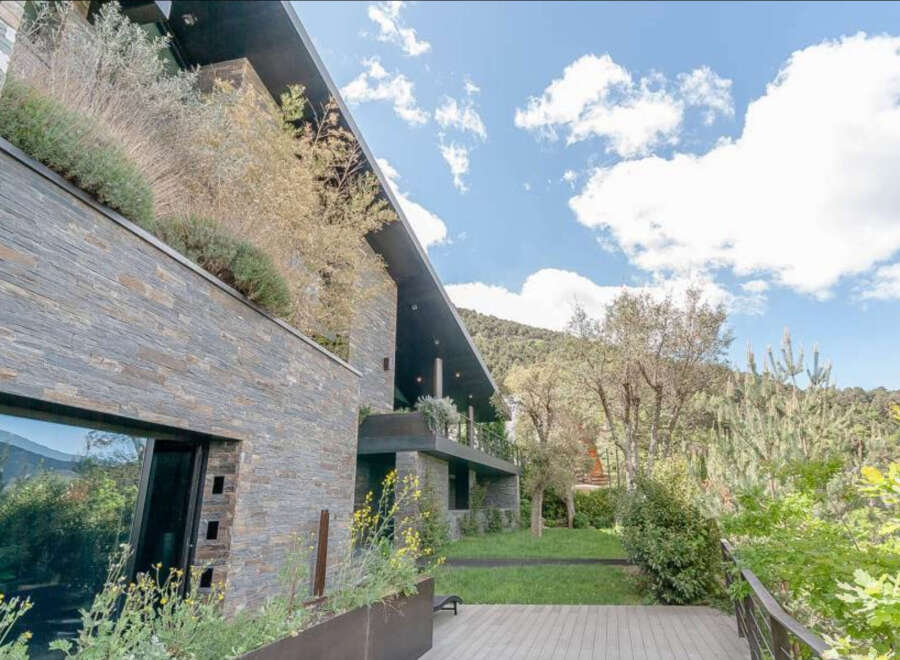 This stunning property boasts a modern design with luxurious finishes and breathtaking mountain views.