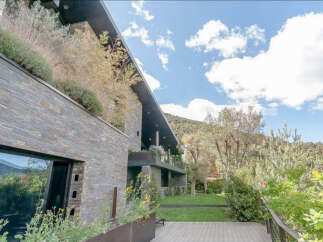 This stunning property boasts a modern design with luxurious finishes and breathtaking mountain views.
