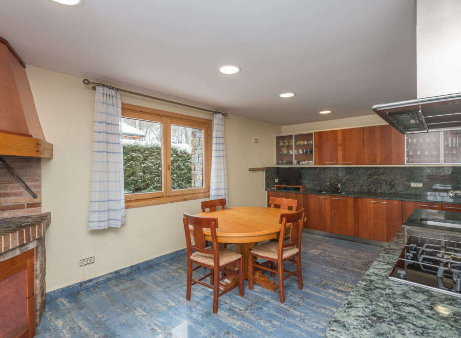 This stunning kitchen boasts a beautiful granite countertop, modern appliances, and ample cabinetry.
