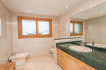 This stunning bathroom boasts a spacious design with modern fixtures and finishes.