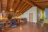 This stunning property boasts a spacious attic conversion with exposed wooden beams and a cozy reading nook.