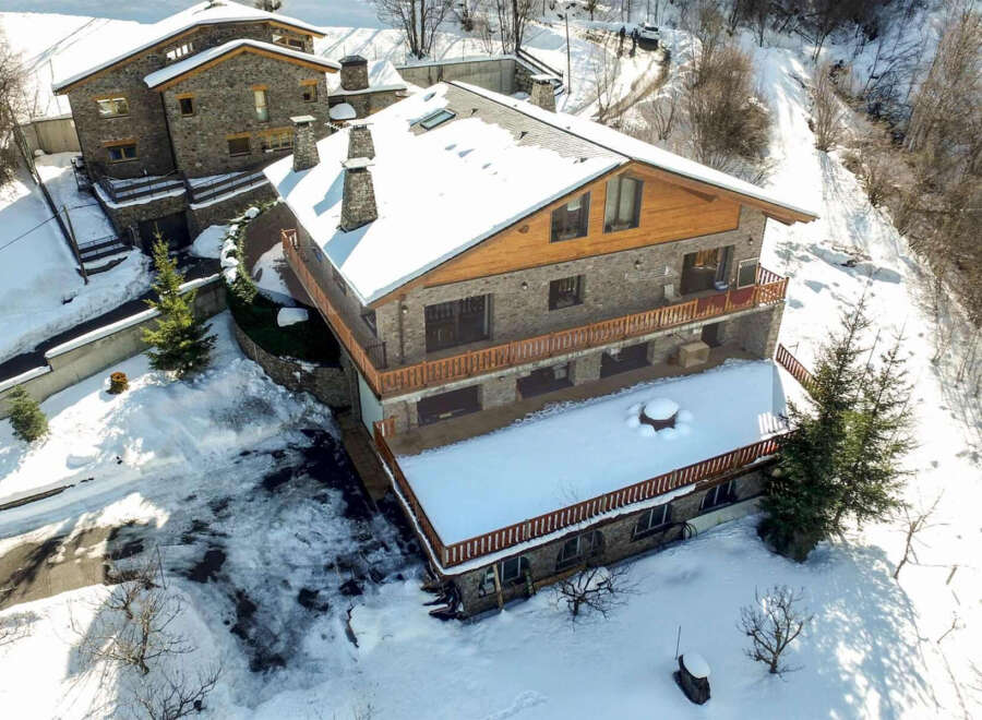 This stunning mountain property boasts two charming stone buildings, perfect for a cozy retreat or a unique investment opportunity.