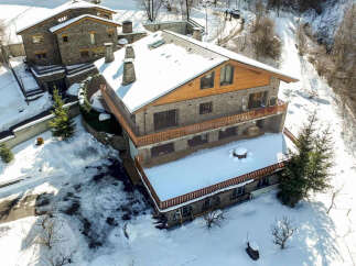This stunning mountain property boasts two charming stone buildings, perfect for a cozy retreat or a unique investment opportunity.