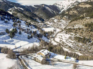 Nestled in a stunning snow-covered mountain valley, this charming property offers breathtaking views and serene surroundings.
