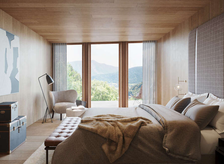 Wake up to breathtaking mountain views from this luxurious bedroom.