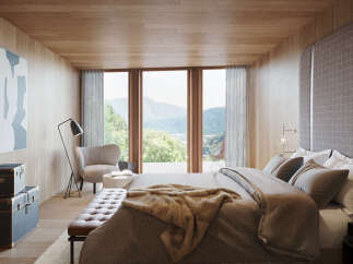 Wake up to breathtaking mountain views from this luxurious bedroom.
