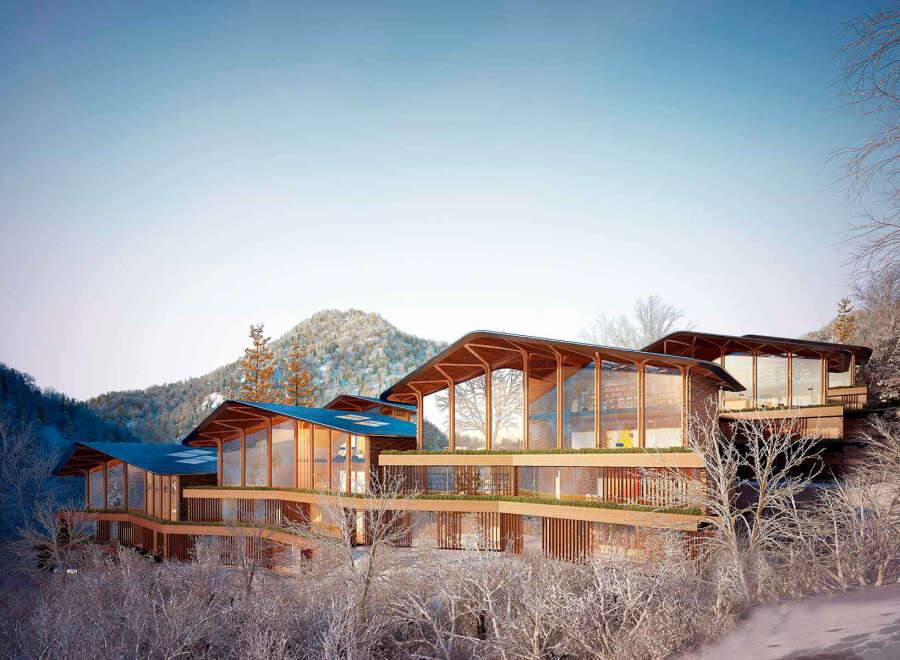 Stunning mountaintop home with expansive windows offering breathtaking views.