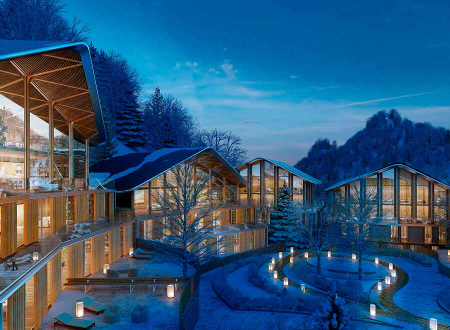 Luxury mountain resort nestled in a snowy landscape.