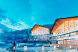 Luxury apartments nestled in a snowy mountainside setting.