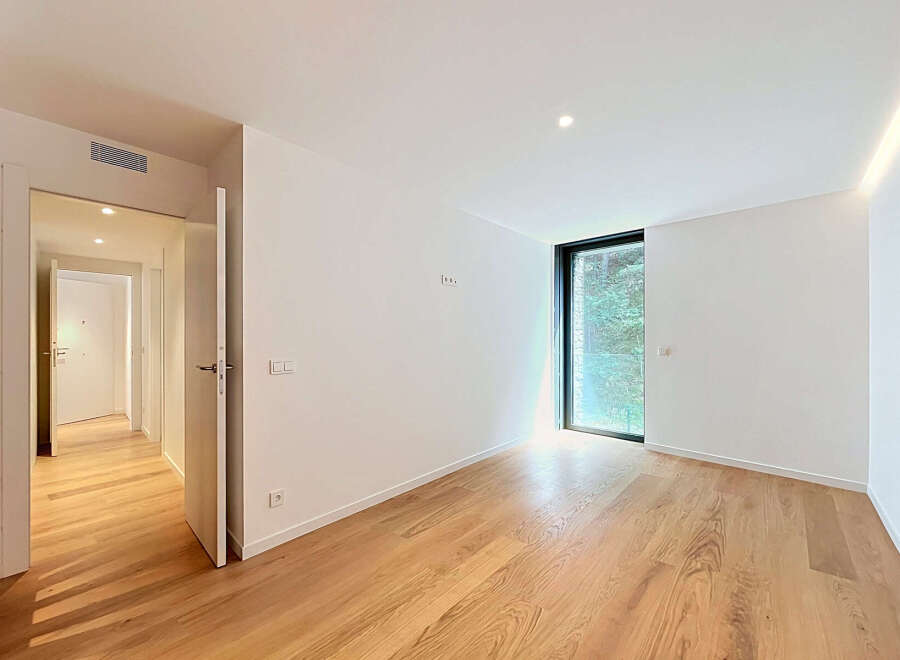 Experience modern living in this unfurnished apartment featuring a spacious, light-filled room with elegant hardwood floors.