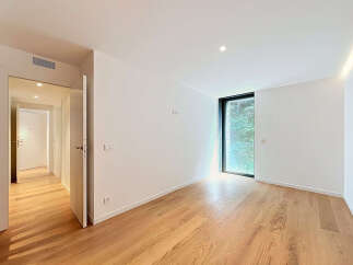 Experience modern living in this unfurnished apartment featuring a spacious, light-filled room with elegant hardwood floors.