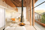 Stunning modern home with open floor plan, featuring a sleek fireplace as the centerpiece.