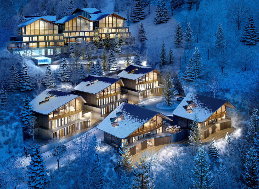 Luxury ski-in/ski-out chalets nestled in a snowy mountainside, offering breathtaking views and modern amenities.