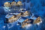 Luxury ski-in/ski-out chalets nestled in a snowy mountainside, offering breathtaking views and modern amenities.