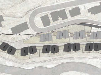 This stunning property boasts a unique architectural design, featuring a cluster of modern homes nestled into a hillside setting.