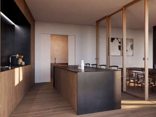 Stunning modern kitchen with sleek dark countertops and wood cabinetry, seamlessly integrated with a dining area.
