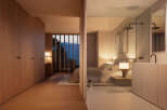 Luxurious bedroom with ensuite bathroom boasting mountain views.