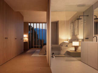 Luxurious bedroom with ensuite bathroom boasting mountain views.